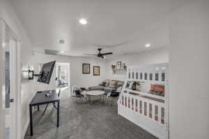 Carpeted bedroom with recessed lighting and visible vents