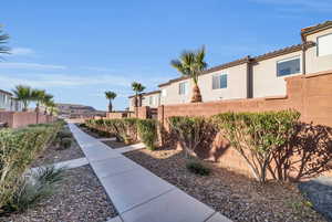 View of yard featuring fence and a residential view