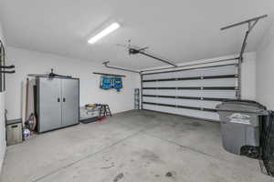 Garage featuring a garage door opener