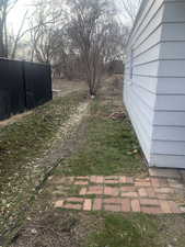 View of yard featuring fence