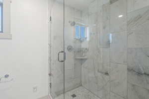 Full bath featuring a stall shower