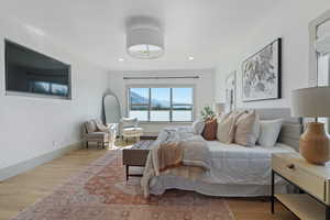 Bedroom featuring recessed lighting, baseboards, and wood finished floors