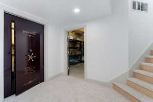 Hall featuring stairway, carpet flooring, visible vents, and recessed lighting