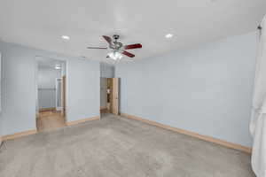 Unfurnished bedroom with recessed lighting, carpet flooring, and baseboards