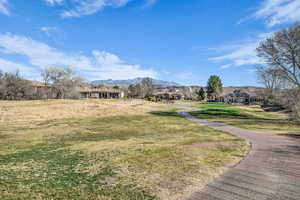 Exterior space featuring a mountain view and a lawn