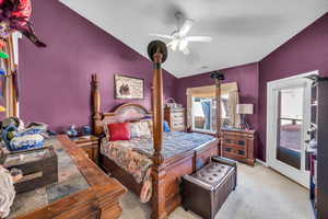 Bedroom with ceiling fan, light carpet, visible vents, baseboards, and vaulted ceiling