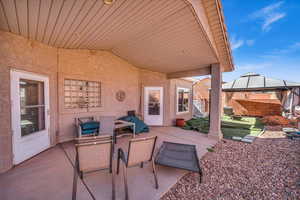 View of patio with fence and a gazebo