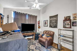 Bedroom featuring visible vents, ceiling fan, and wood finished floors