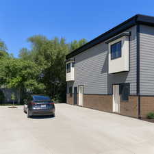 View of side of property featuring brick siding