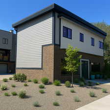 View of side of home featuring brick siding