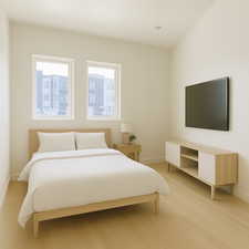 Bedroom featuring baseboards and light wood-style flooring with virtual staging