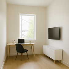 Office featuring baseboards and light wood-style floors with virtual staging