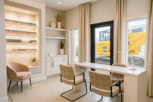 Home office featuring built in features and recessed lighting with virtual staging