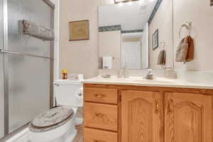 3/4 Bathroom with toilet and tub/shower, tile floors.