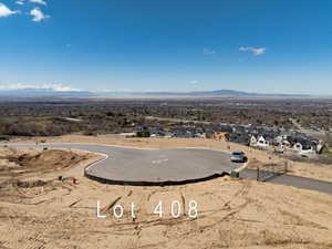 Birds eye view of property with a mountain view and a residential view