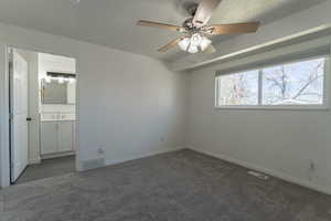 Bedroom 1 with bathroom entrance  natural light, and NEW carpet