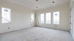 Spare room featuring a textured ceiling and baseboards