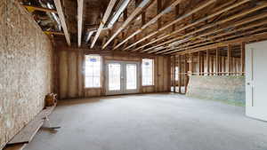 Miscellaneous room featuring french doors