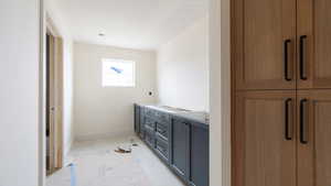 Bathroom featuring a textured ceiling and baseboards
