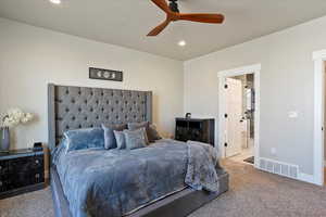 Bedroom featuring a textured ceiling, recessed lighting, visible vents, baseboards, and carpet