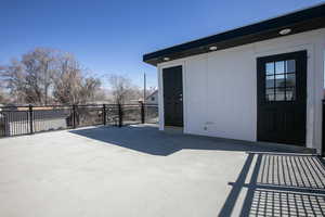 View of patio with fence