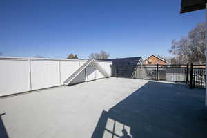 View of patio with fence