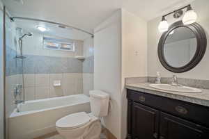 Bathroom with toilet, shower / bath combination, vanity, and visible vents