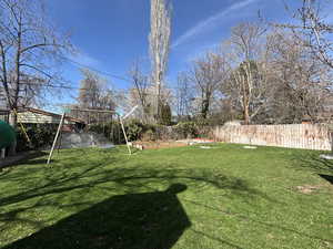 View of yard with a fenced backyard