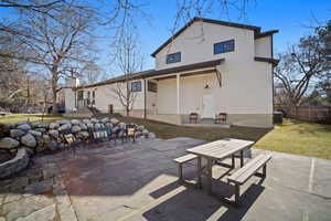 Back of house with a yard, a patio area, and fence