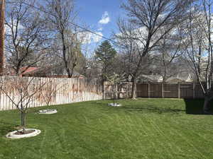 View of yard with fence
