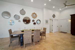 Dining area featuring ceiling fan, high vaulted ceiling, baseboards, and recessed lighting