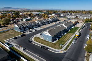 Birds eye view of property with a residential view and a mountain view