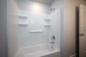 Full bathroom with shower / tub combination