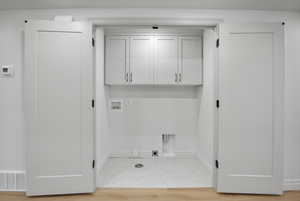 Laundry area with cabinet space