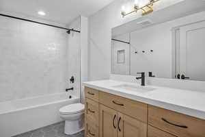 Full bath with tile patterned floors, tub / shower combination, and vanity