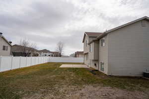 View of yard with a patio area and a fenced backyard