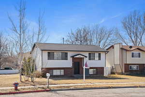 Bi-level home with brick siding