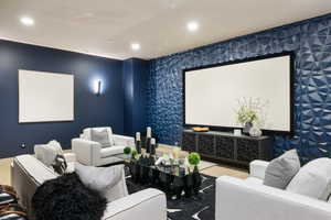 Home theater featuring recessed lighting and wallpapered walls