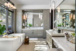 Full bath featuring wood finished floors and vanity