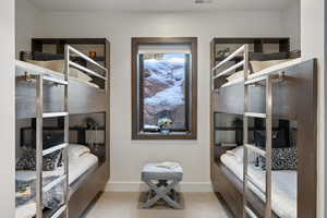 Bedroom with baseboards and visible vents