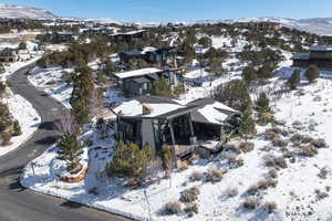 Snowy aerial view featuring a residential view and a mountain view