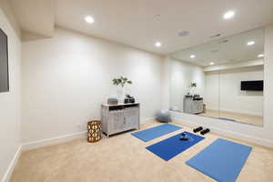 Workout area with visible vents, baseboards, carpet flooring, and recessed lighting