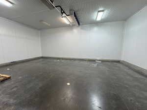 Garage featuring metal wall