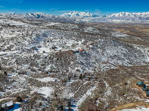 Snowy aerial view featuring a mountain view