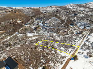 Snowy aerial view with a mountain view