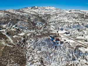 Snowy aerial view featuring a mountain view