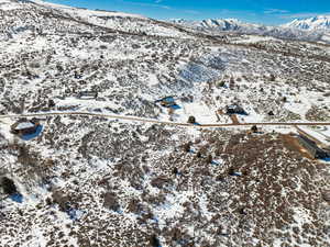 Snowy aerial view featuring a mountain view