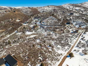 Snowy aerial view featuring a mountain view