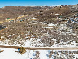 Snowy aerial view featuring a mountain view