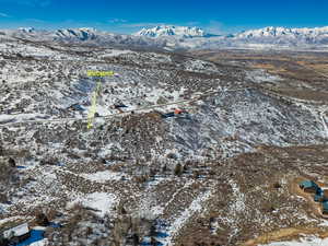 Snowy aerial view with a mountain view